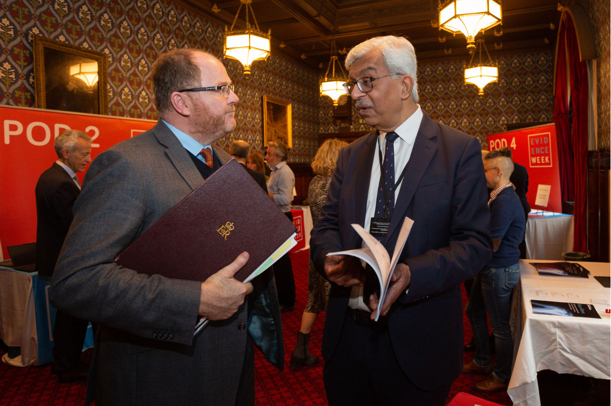 Professor Munir Pirmahamed talking to Minister for Science, Research & Innovation, George Freeman MP, at Evidence Week 2022.