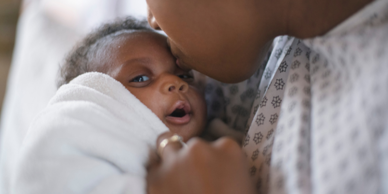 A mother holding a newborn baby